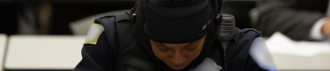 A female police officer rests for a moment.